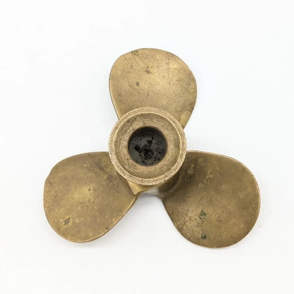 Vintage brass propeller candle holder and snuffer